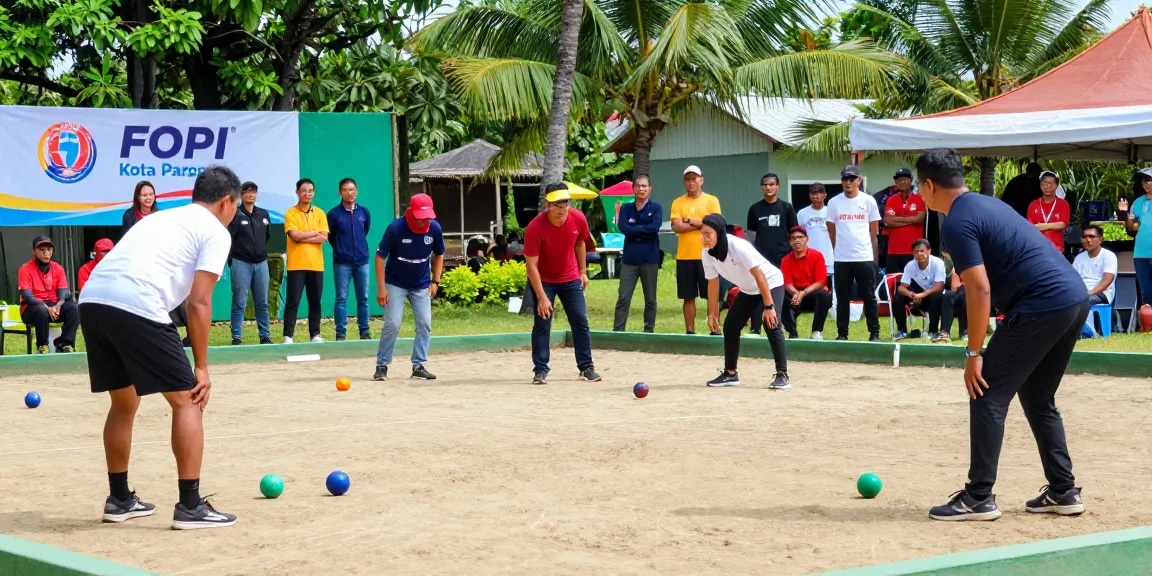 Enjoying a competitive petanque game at FOPI Kota Parepare with participants and spectators.